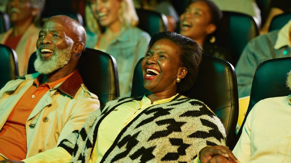 Senior couple laughing in cinema